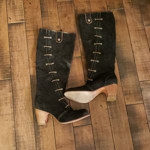 Cubanas tall black heeled boots w lacing detail.